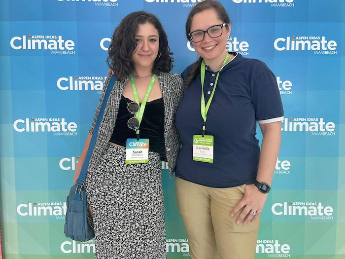 Picture, from left to right, of Sarah VanSchoick and Gavriella Hecht. The backdrop features the logo for the conference with climate as the largest word.