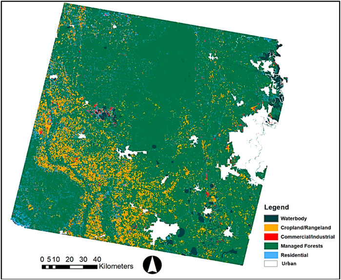 Map of managed forests in green, cropland and rangeland in orange, commercial and industrial areas in red, residential areas in blue, urban areas in white, and water bodies in dark green. The area covers northern Florida and southeast Georgia.